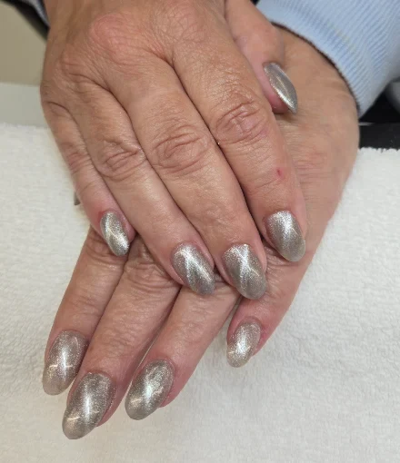 Soft silver cat-eye manicure by Top 10 Nails Spa