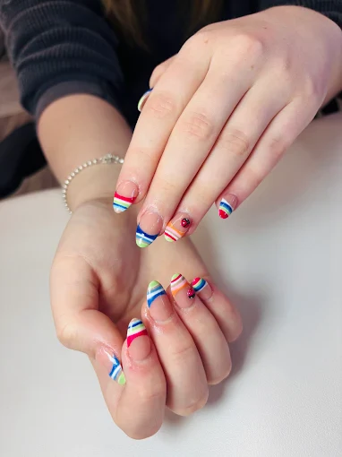 Rainbow striped French manicure by Top 10 Nails Spa