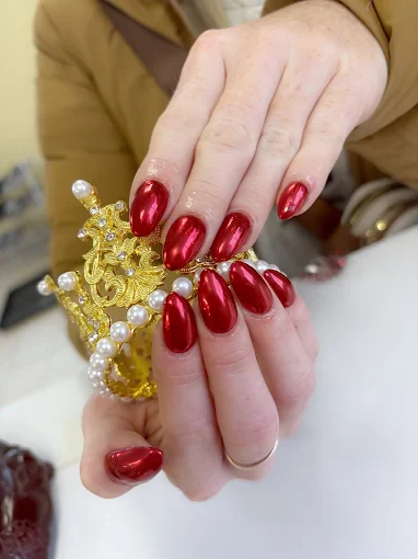 Ruby red chrome oval nails by Top 10 Nails Spa