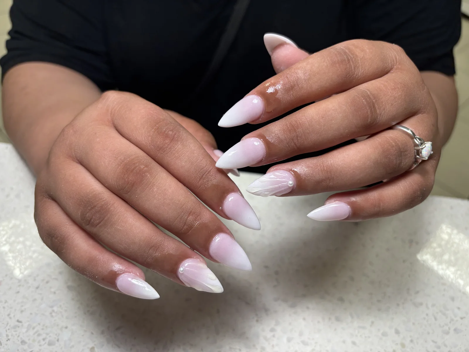 Pearl white French almond manicure by Top Ten Nails Spa