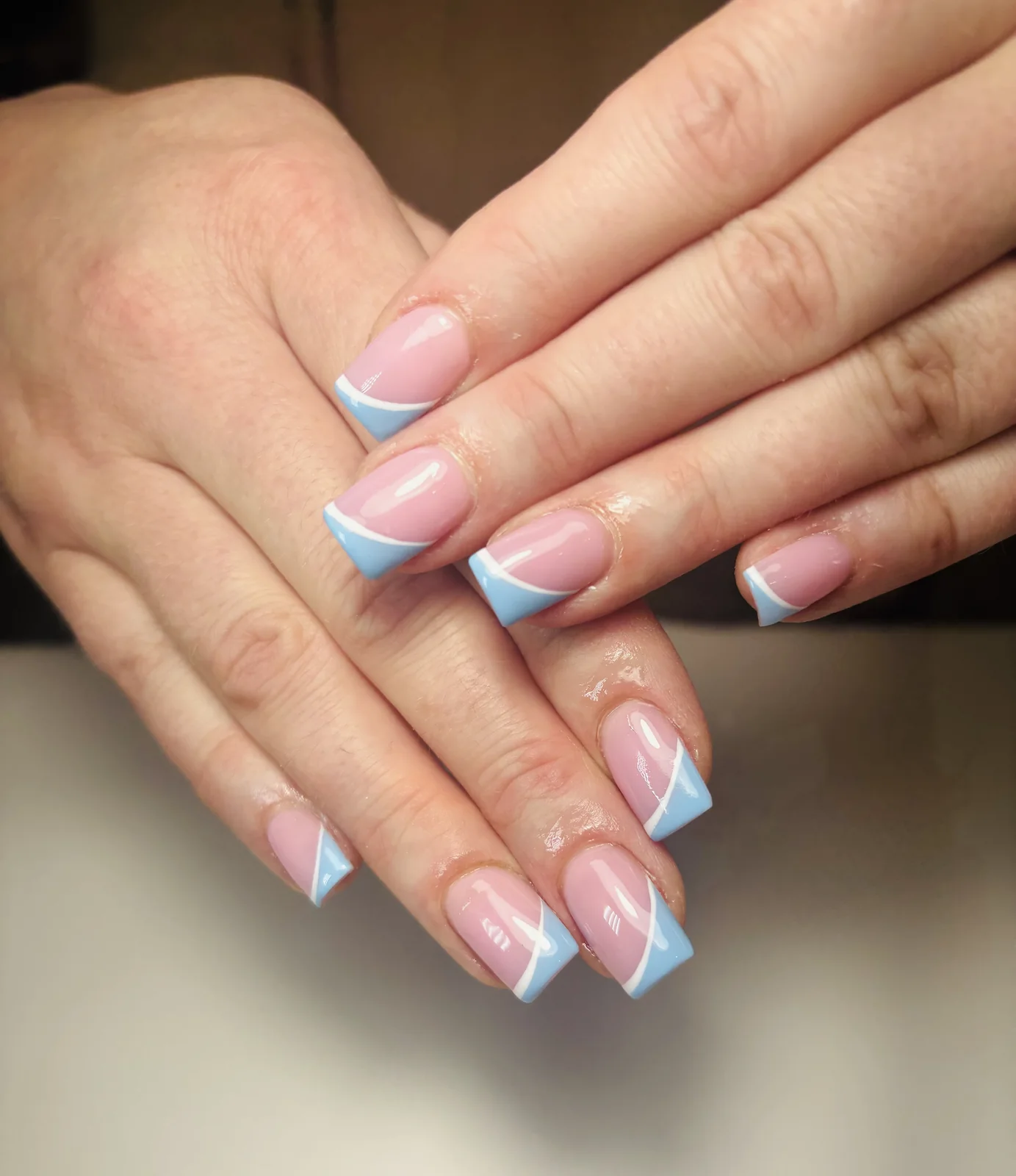 Pastel blue and pink French square nails by Top Ten Nails Spa