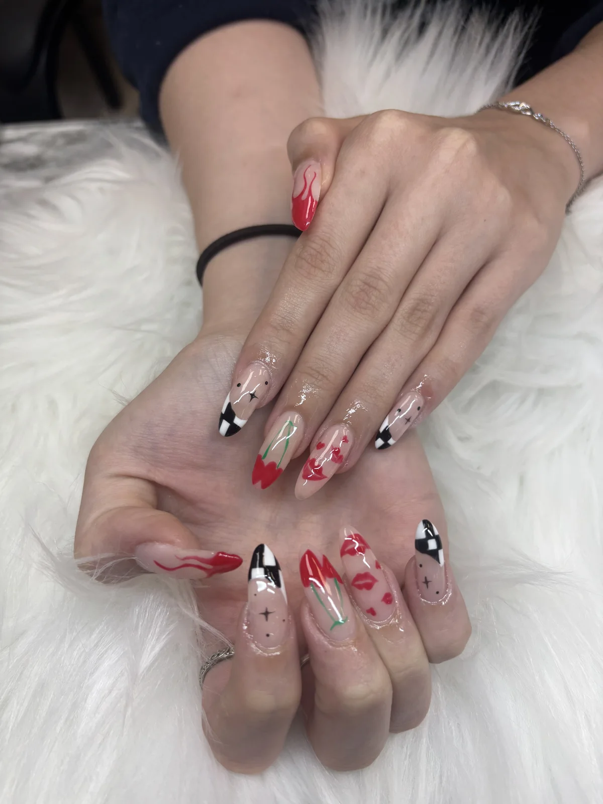 Holiday nail art with red tips and sparkling details by Top Ten Nails Spa
